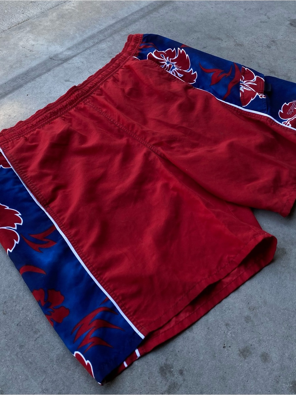 Speedo red and blue floral pattern swim trunks with red mesh lining
